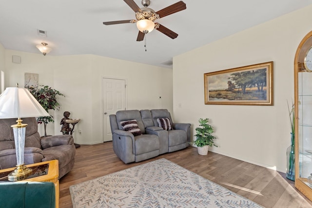 living room with hardwood / wood-style floors and ceiling fan