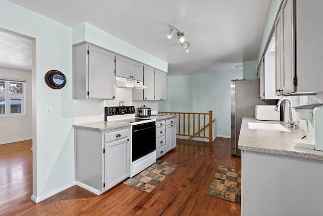 kitchen with sink, dark hardwood / wood-style flooring, and electric stove