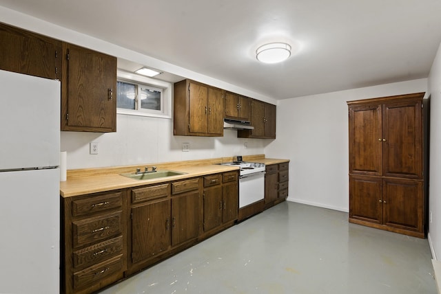 kitchen featuring dark brown cabinets, sink, and white appliances