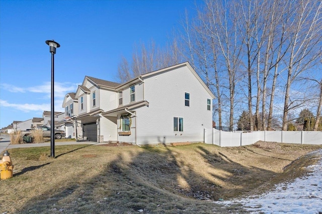 view of side of property featuring a garage