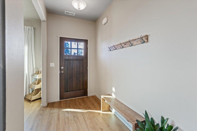 entryway with light hardwood / wood-style flooring