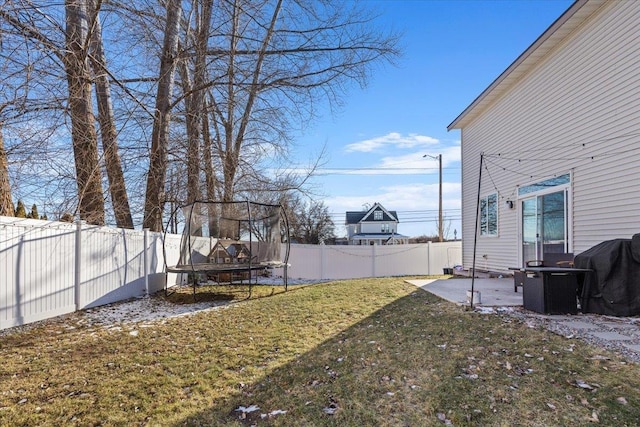 view of yard with a patio area and a trampoline