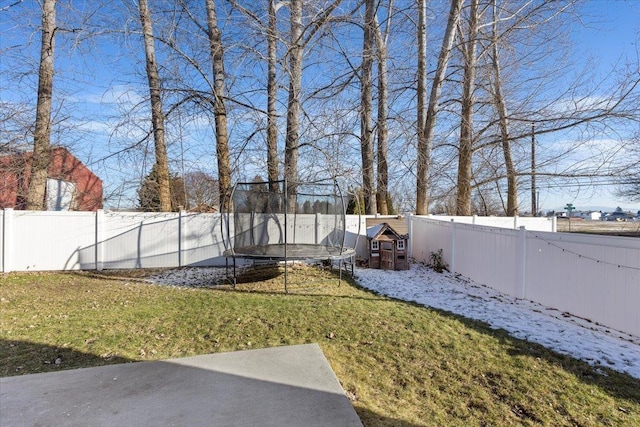 view of yard with a trampoline