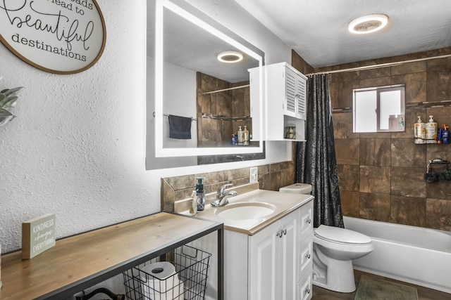 full bathroom featuring vanity, toilet, and shower / bath combo with shower curtain