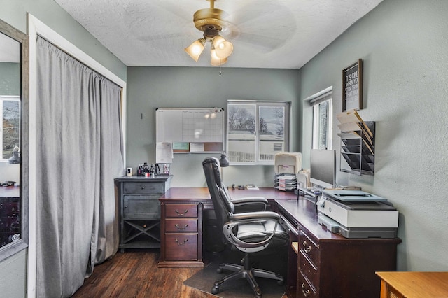 office with a textured ceiling, dark hardwood / wood-style floors, and ceiling fan