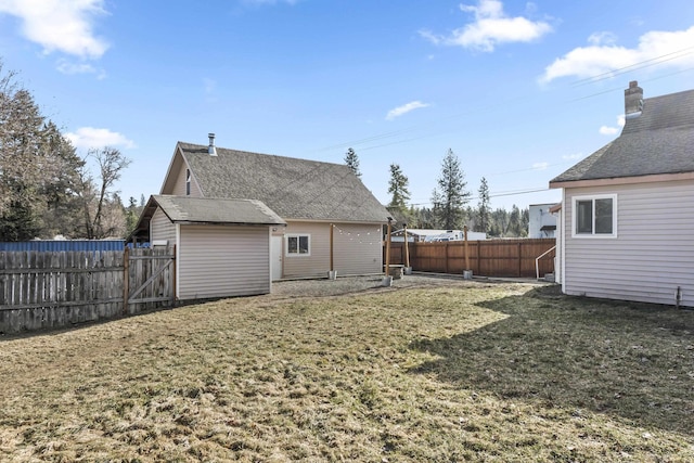 rear view of property featuring a yard