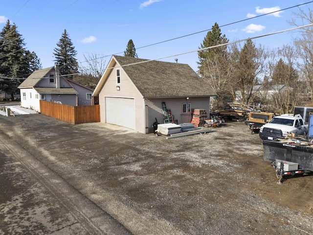 view of side of property with an outbuilding and a garage