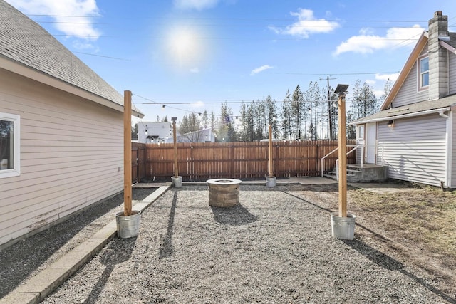 view of yard featuring an outdoor fire pit