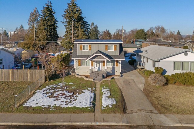 view of front of property with an outbuilding, a garage, and a front lawn