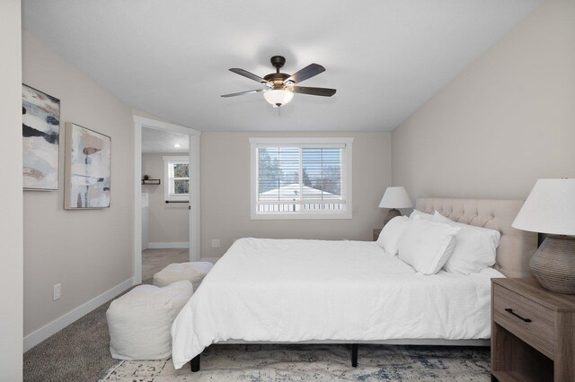 bedroom with ceiling fan, carpet floors, and lofted ceiling with beams