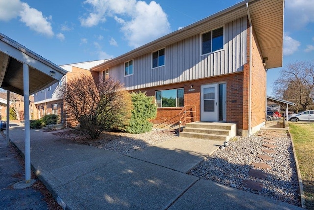 12409 E Olive Ave, Spokane Valley, WA 99216 - view of front facade featuring brick siding, board and batten siding, and entry steps