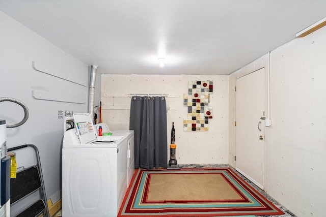 laundry room featuring washing machine and clothes dryer