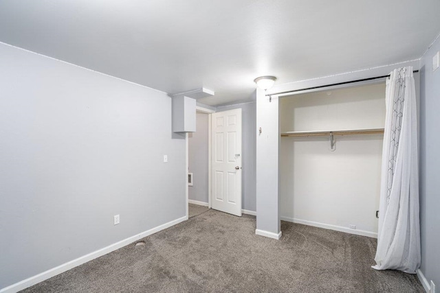 unfurnished bedroom with a closet and carpet