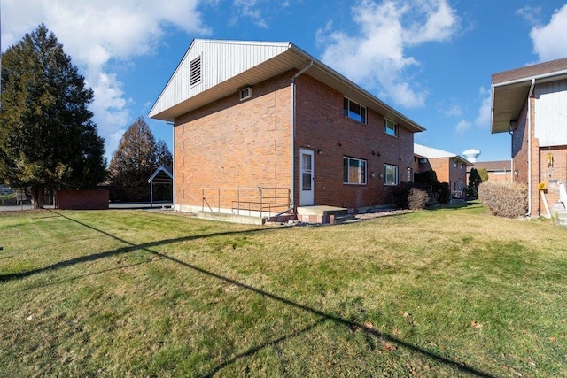 back of house featuring a yard