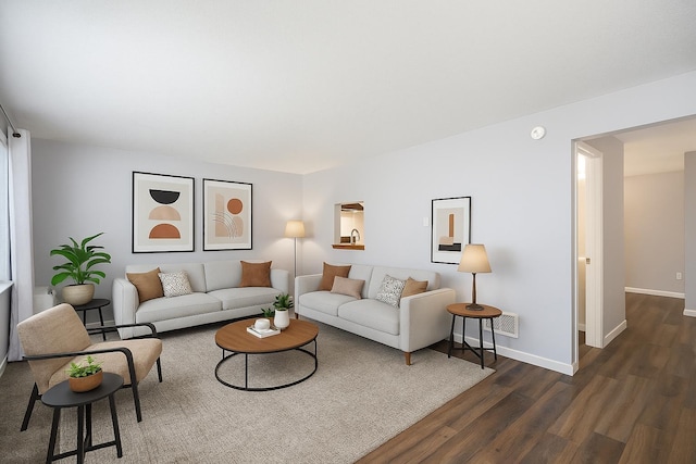 12409 E Olive Ave, Spokane Valley, WA 99216 - living area featuring dark wood-style floors and baseboards