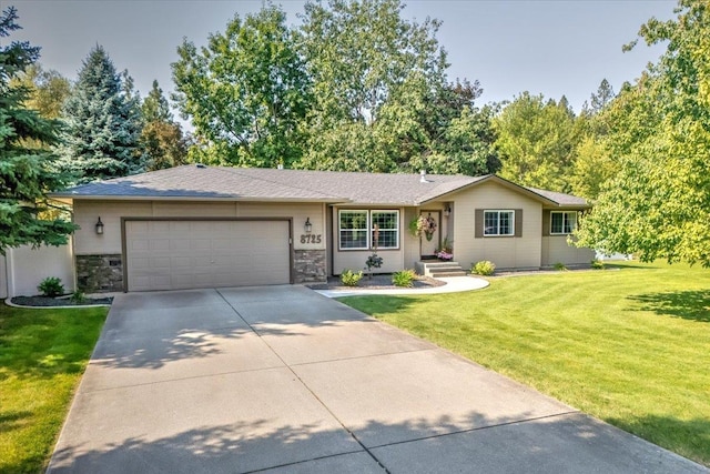 ranch-style home with a garage and a front yard