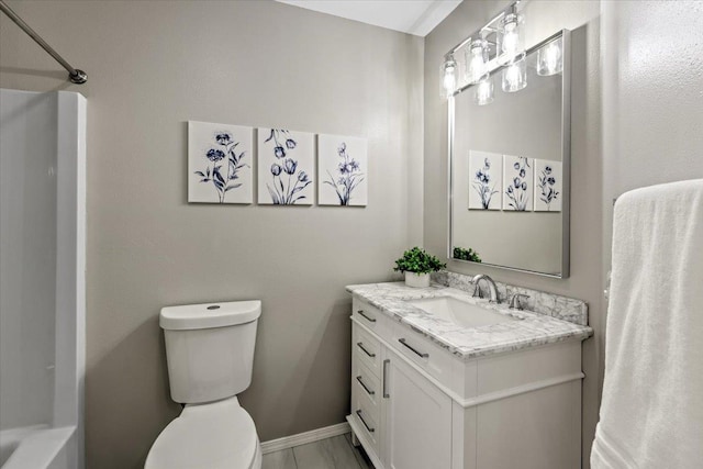 bathroom featuring vanity and toilet