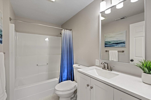 full bathroom featuring toilet, a textured ceiling, vanity, shower / bath combo, and tile patterned flooring