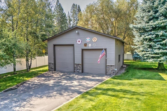 garage featuring a yard