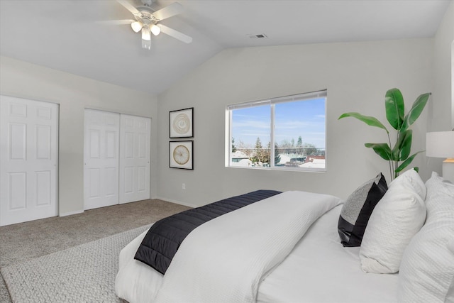 carpeted bedroom featuring vaulted ceiling, a closet, and ceiling fan