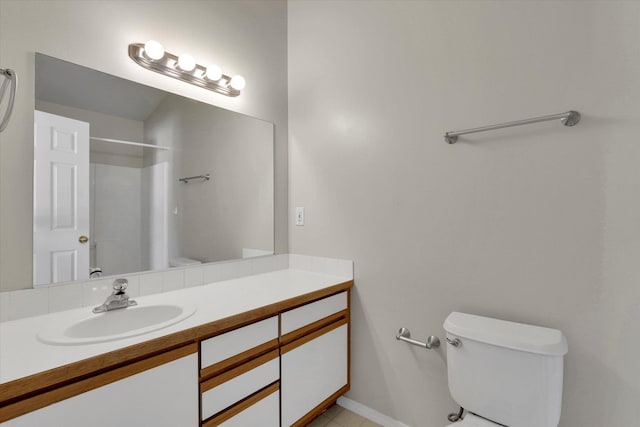 bathroom featuring walk in shower, vanity, and toilet