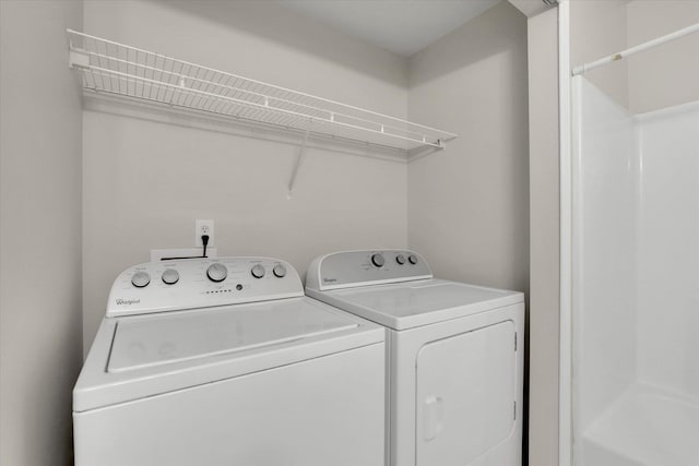 clothes washing area featuring washing machine and dryer