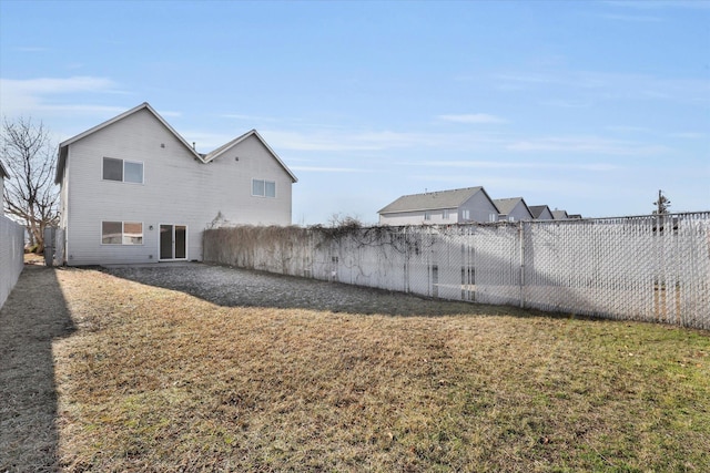 rear view of house with a yard