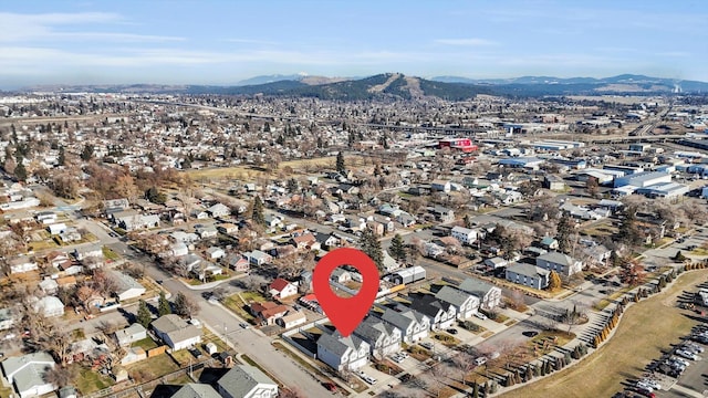 birds eye view of property featuring a mountain view