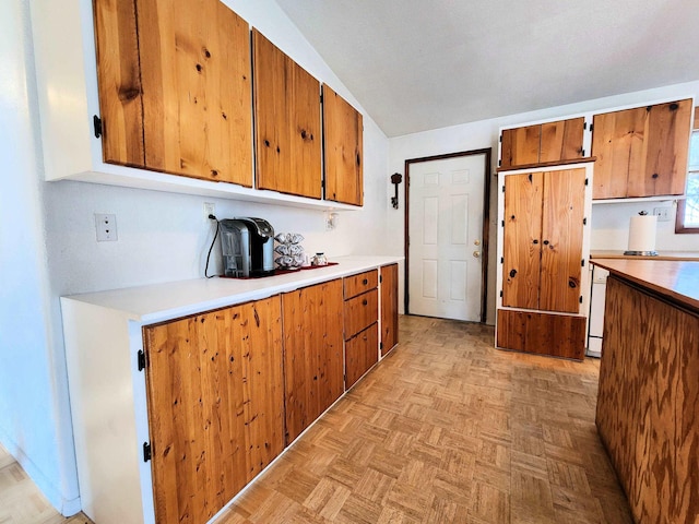 kitchen featuring light parquet flooring and white dishwasher