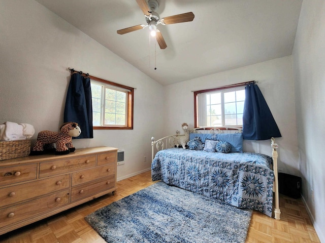 bedroom with multiple windows, light parquet flooring, lofted ceiling, and ceiling fan