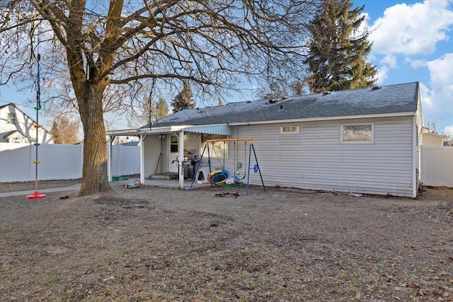 back of house with a patio