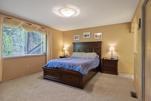 bedroom with light carpet