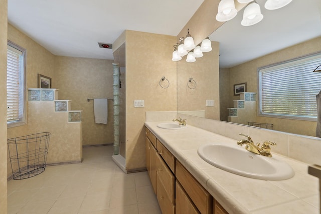 bathroom with vanity and a shower