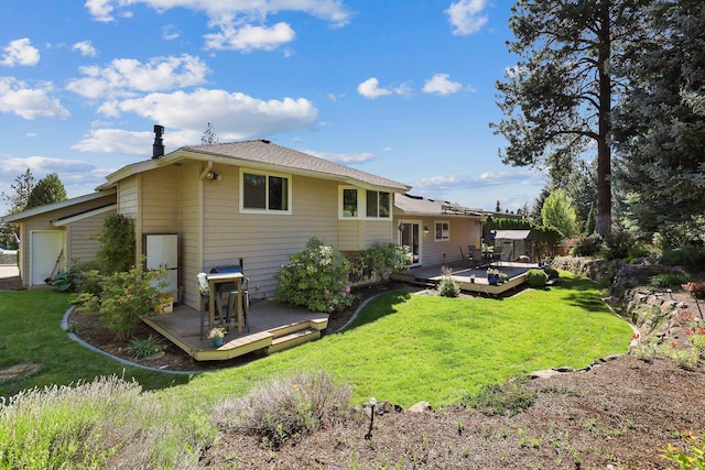 rear view of property with a wooden deck and a lawn