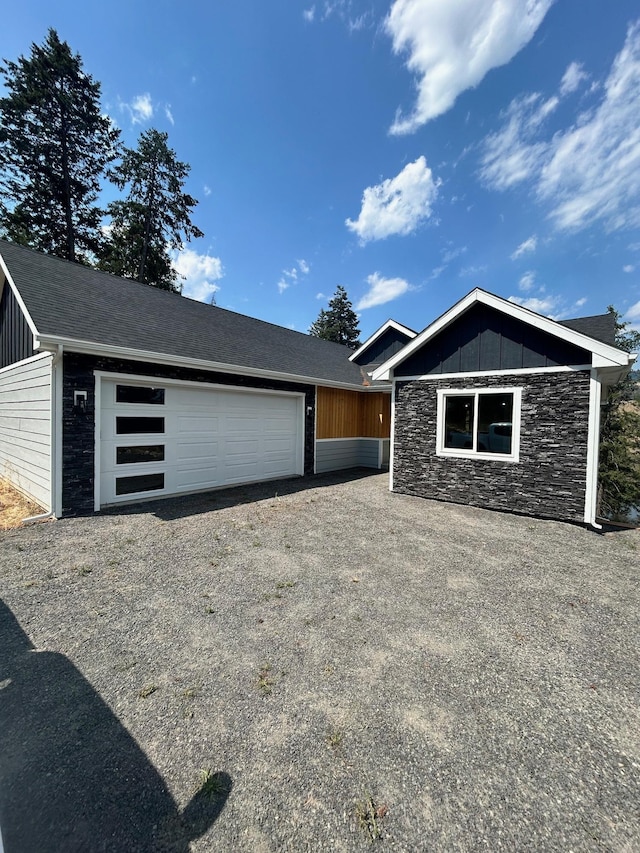 view of front of property featuring an outbuilding and a garage