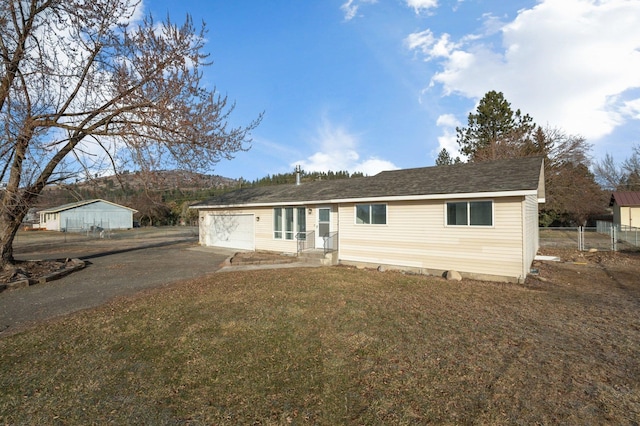 view of front of house with a garage and a front yard