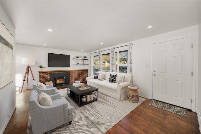 living room featuring dark hardwood / wood-style floors and a fireplace