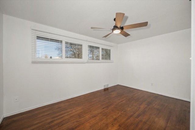 unfurnished room featuring ceiling fan and dark hardwood / wood-style floors