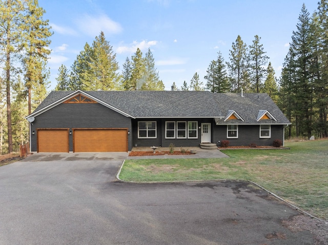 single story home with a garage and a front yard