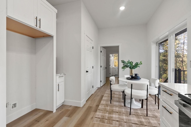 dining area with light wood-type flooring