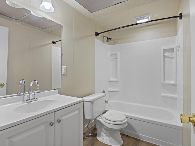 full bathroom with vanity, toilet, tub / shower combination, and wood-type flooring