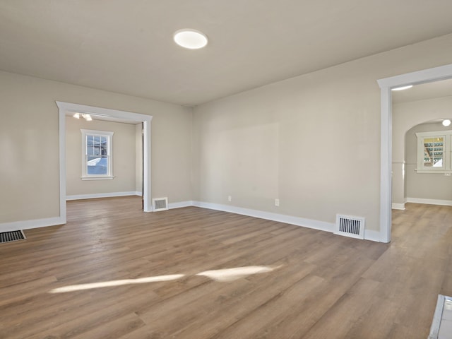 unfurnished room featuring hardwood / wood-style floors