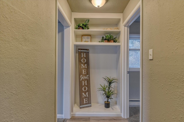 entrance to property featuring baseboard heating