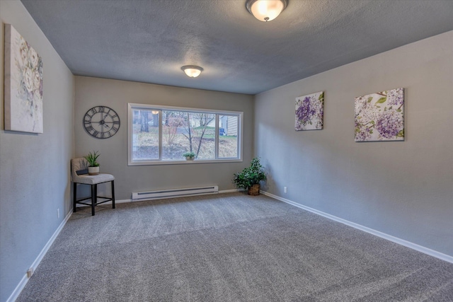 empty room featuring carpet, baseboards, baseboard heating, and a textured ceiling