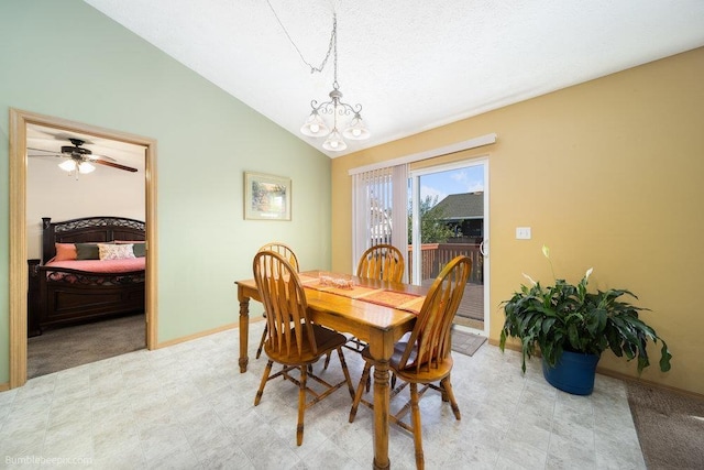 dining space featuring an inviting chandelier and vaulted ceiling