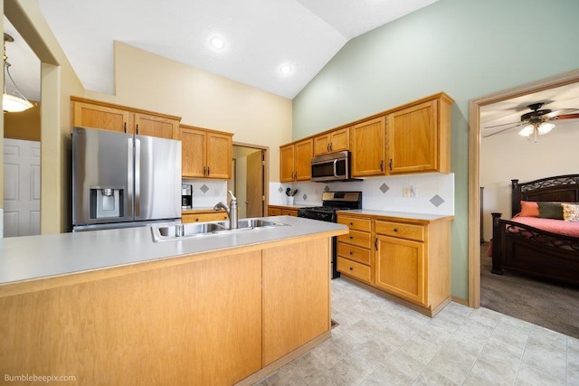 kitchen with stainless steel appliances, tasteful backsplash, sink, and pendant lighting