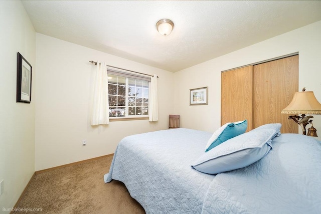 carpeted bedroom featuring a closet