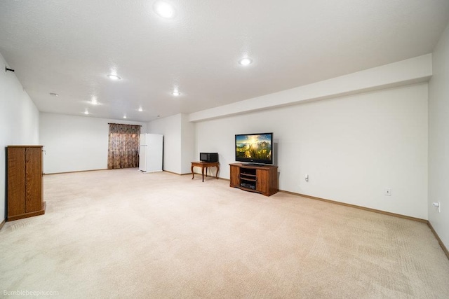 basement with white refrigerator and light carpet