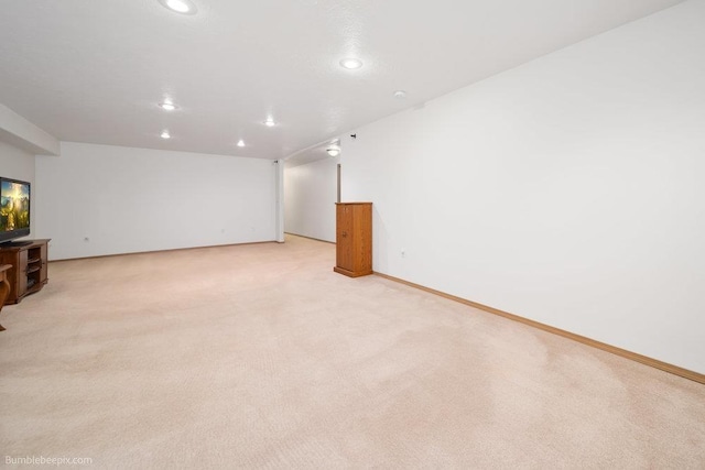 unfurnished living room with light carpet