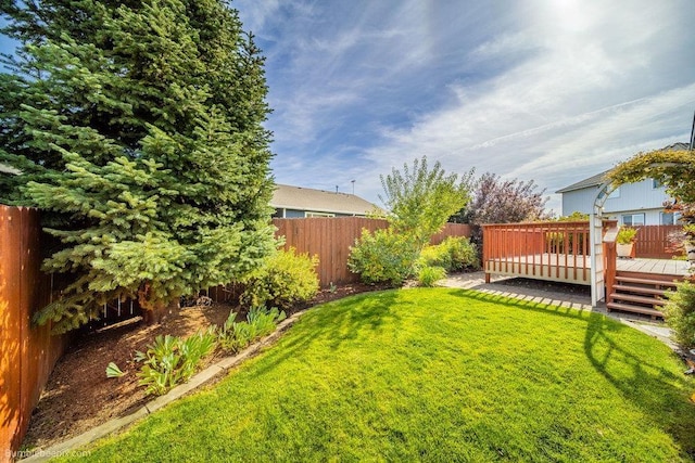 view of yard with a deck